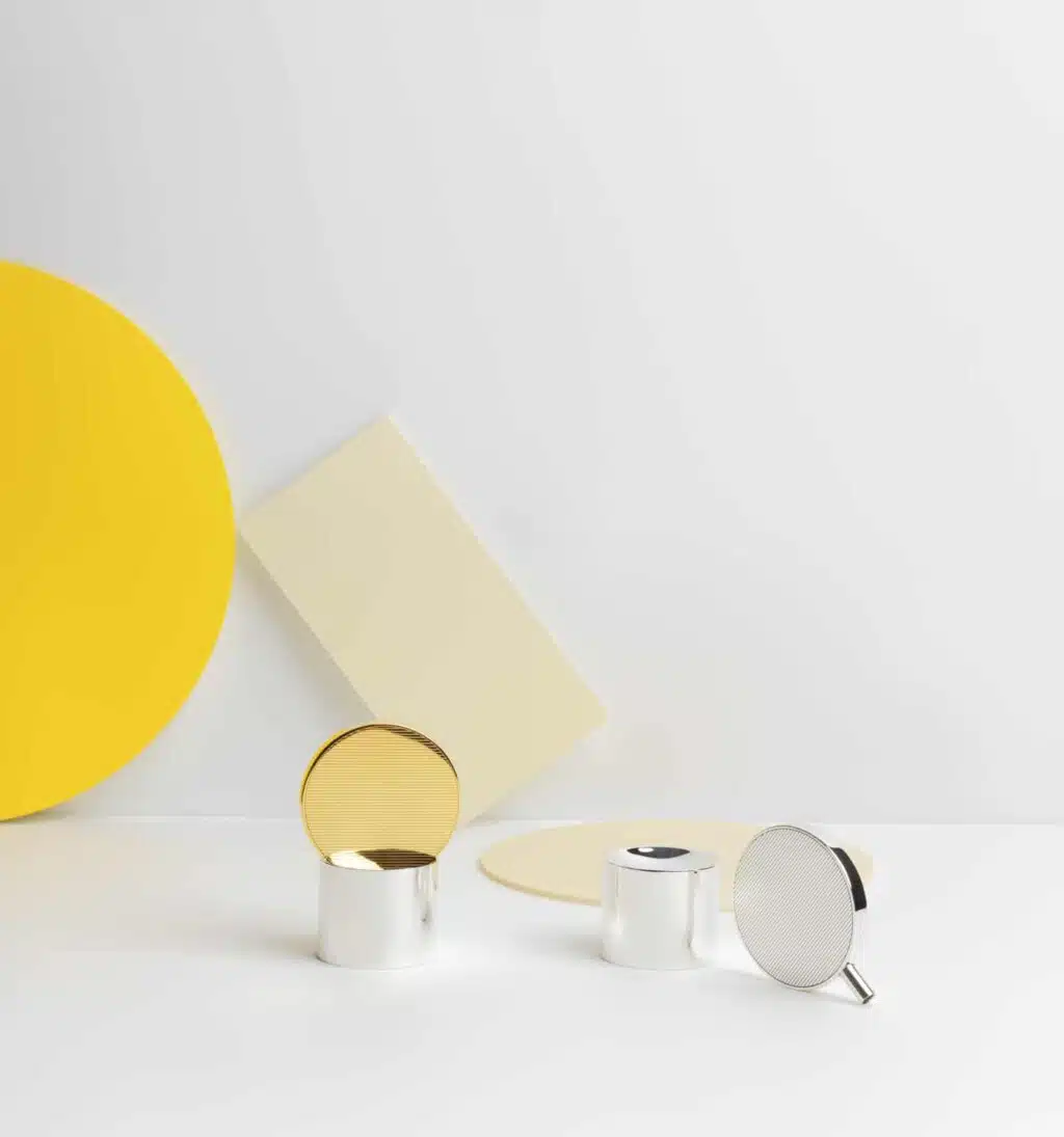 Pepper and salt mills in sterling silver from Houlgate collection from Puiforcat in front of a white wall