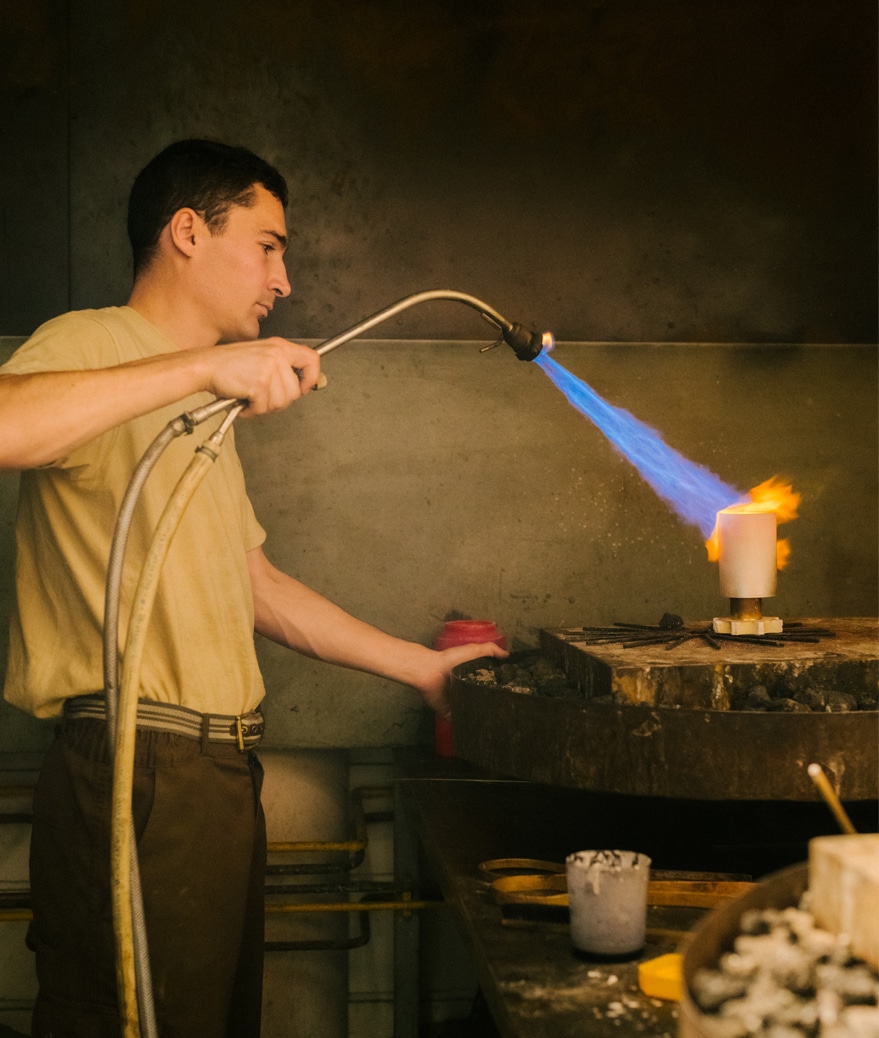 Silversmith working on a prestige piece in sterling silver