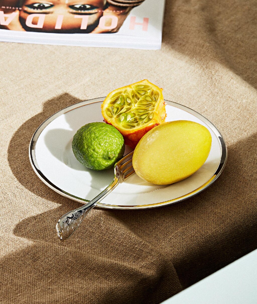 Table fork from Elysée collection in sterling silver photographed on a full of fruits' plate from collection Cercle d'orfèvre