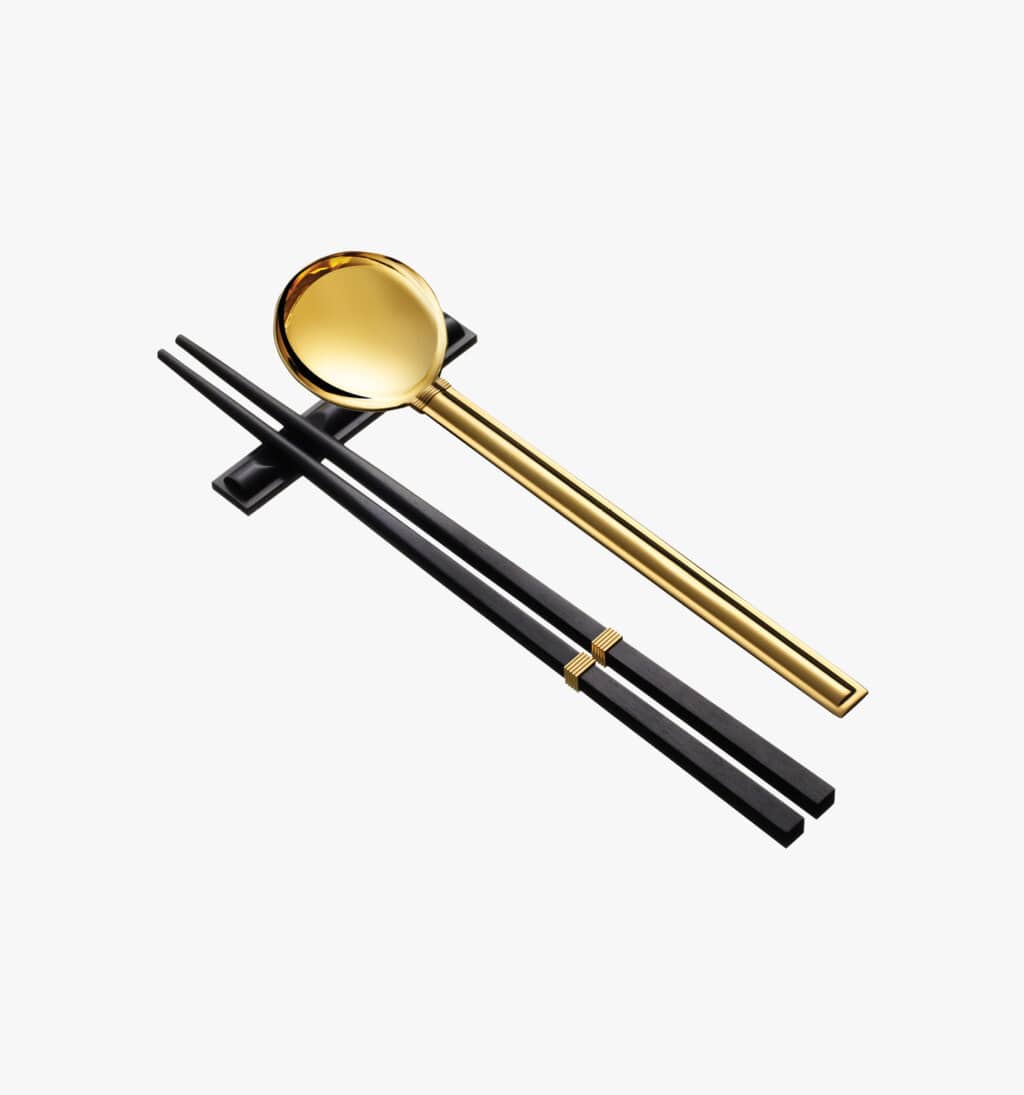Puiforcat Cannes collection in sterling silver and gold gilt - set of four pieces composed of a pair of chopsticks, a table spoon and and spoon holder