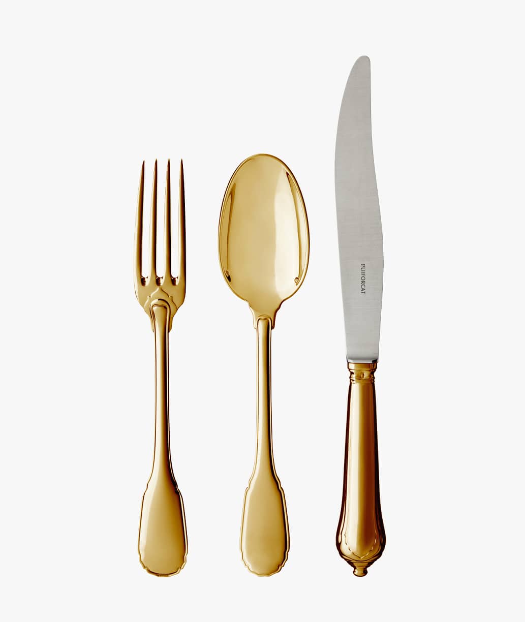 Three pieces of table cutlery in sterling silver and a gold gilt finish from Noailles collection from Puiforcat