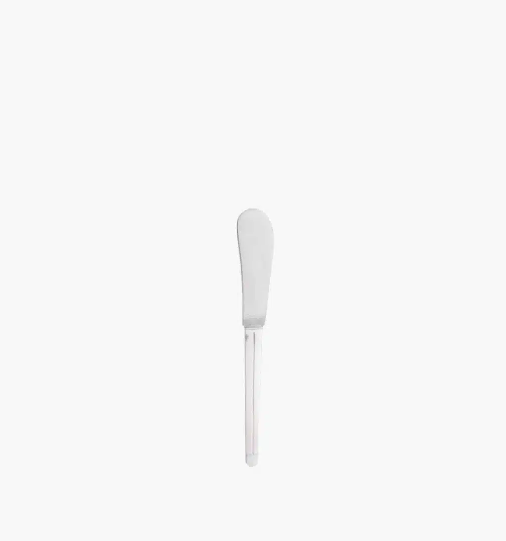Butter spreader in stainless steel from the Guéthary collection by Puiforcat on a light background.