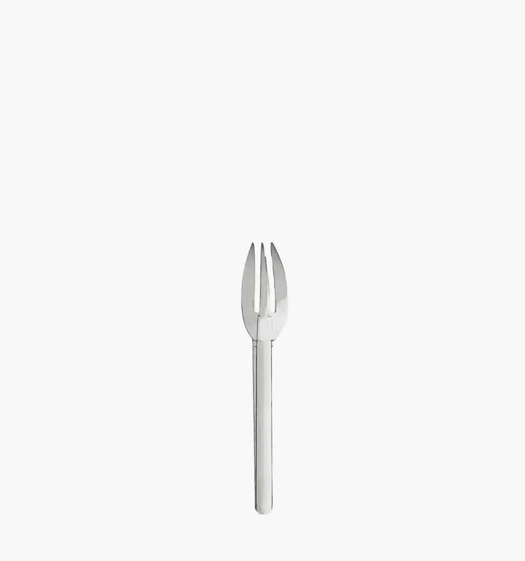 Fish fork in stainless steel from the Guethary by Puiforcat on a light background