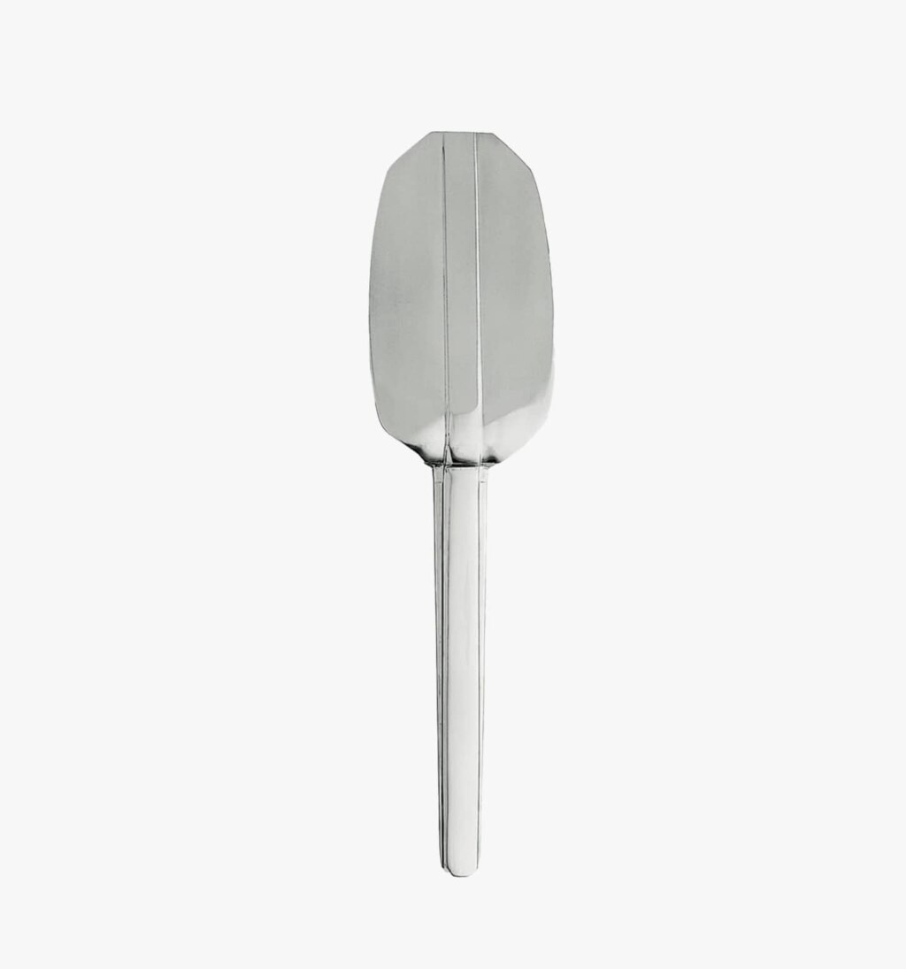 Stainless steel tart server from the Guéthary collection by Puiforcat on a light background.