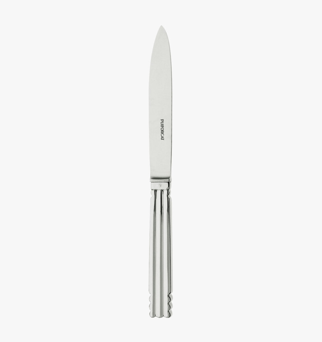 Dessert knife in silver plated from the Nantes collection by Puiforcat on a light background.